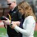 Julie Foguenne, of Parrot in Southfield, operates a second generation augmented reality drone around the field during Michigan Robotics Day at the Jack Roth Stadium Club at Michigan Stadium on Monday, April 15, 2013. Melanie Maxwell I AnnArbor.com